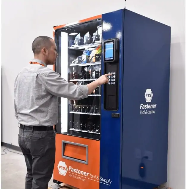 Worker Using Proferred Vending Demonstrating What is Vendor Managed Inventory