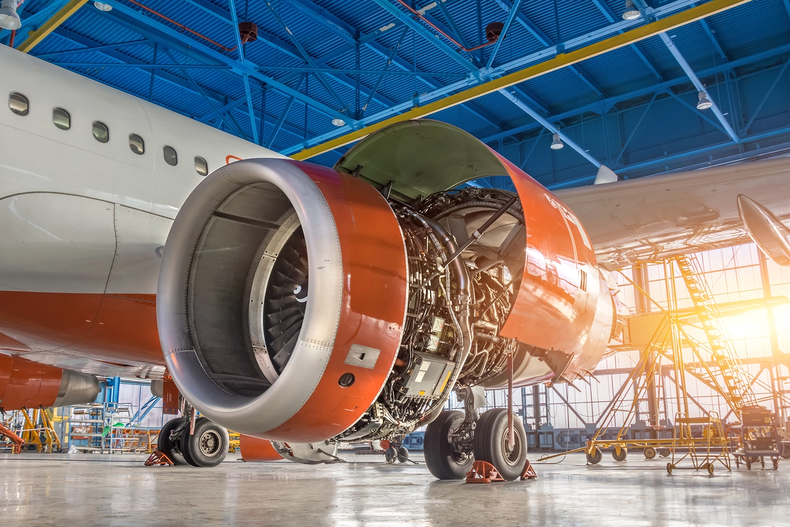 shur lok company aerospace plane in a hanger with turbine exposed